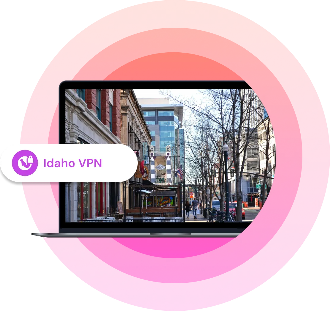 Illustration showing a laptop with a picture of an Idaho city on it with the text "Idaho VPN" next to it